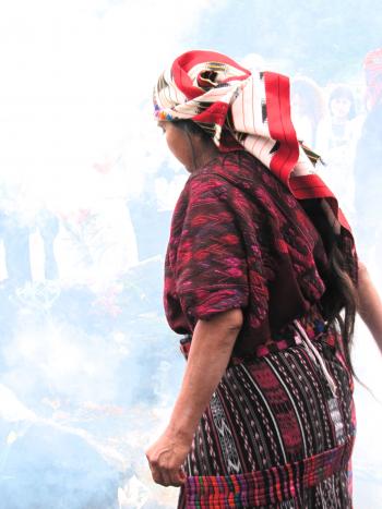 A female shaman performing a ceremony for good fortune in Chichicastenango, Guatemala.